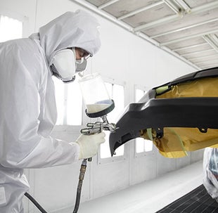 Collision Center Technician Painting a Vehicle | Stapp Interstate Toyota in Frederick CO