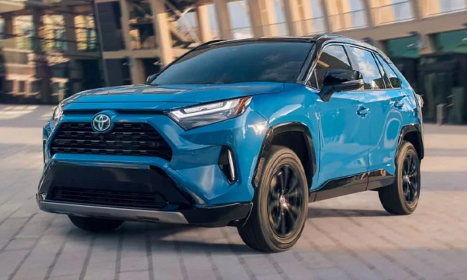 Blue 2024 Toyota RAV4 Hybrid on Cement