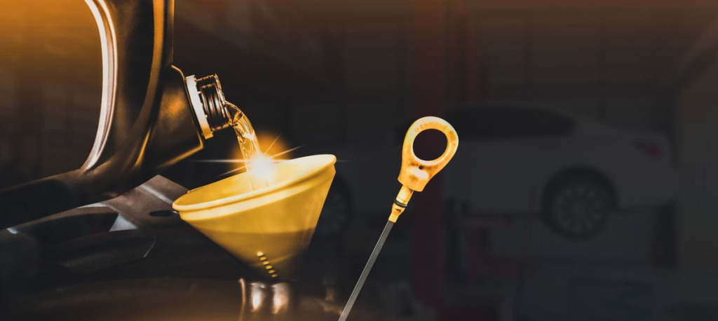 Motor oil being poured into a funnel