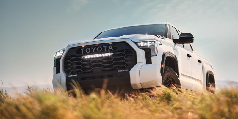 a 2025 Toyota Tundra parked on a grassy hill