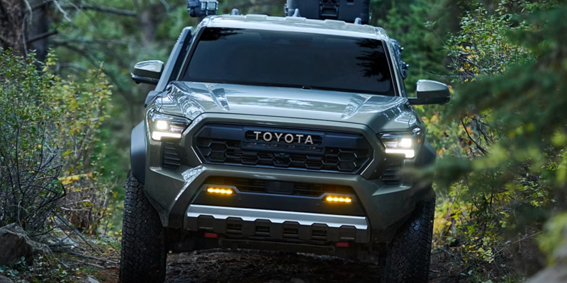 Toyota Tacoma driving offroad highlight its manufacturing history