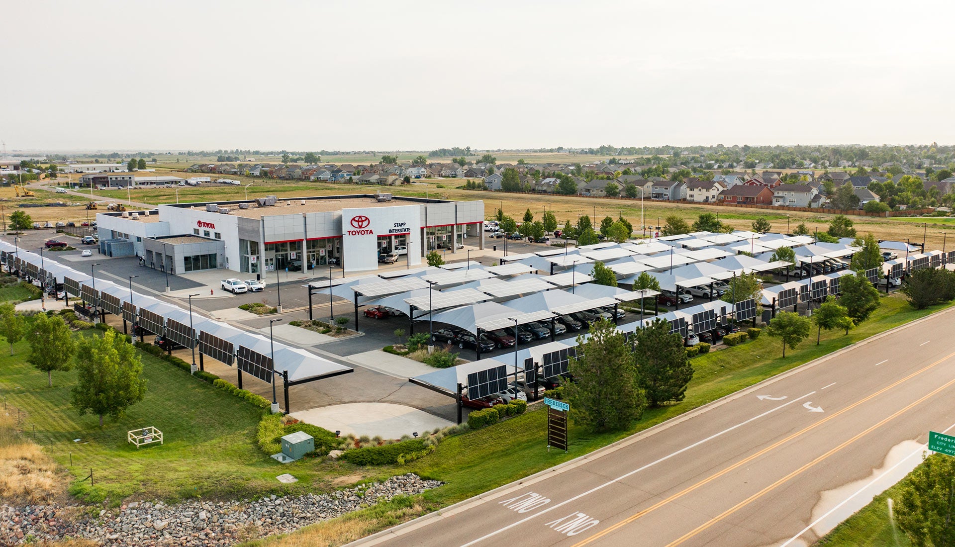 image of employees at Columbia Honda holding up a check
